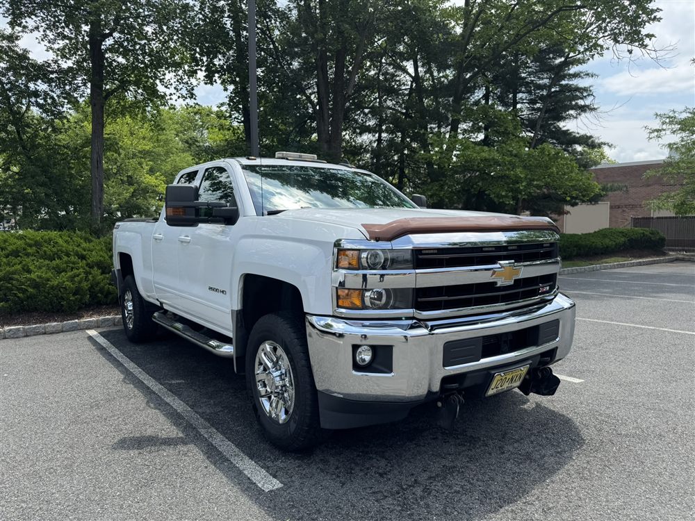 Freshly washed white Chevy Silverado 2500HD truck