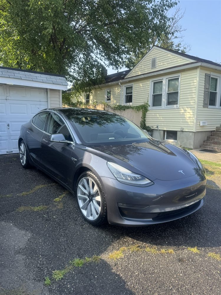 Freshly washed grey Tesla Model 3