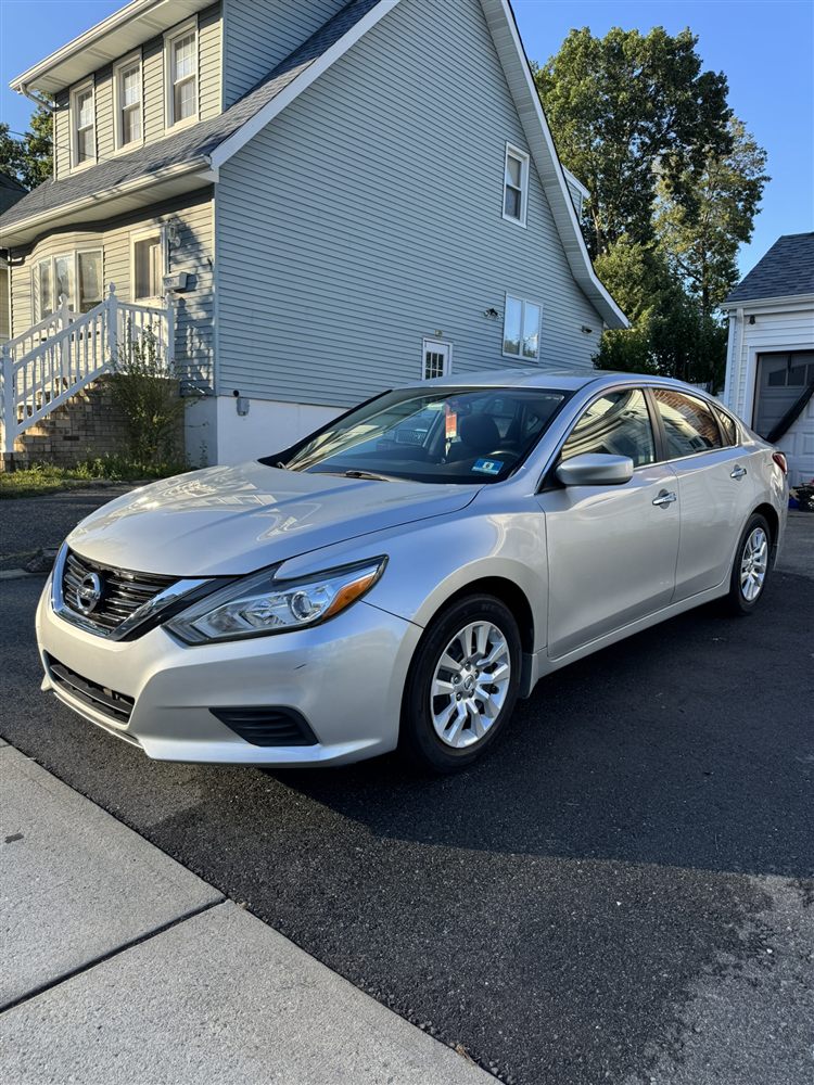 Freshly washed silver Nissan Altima